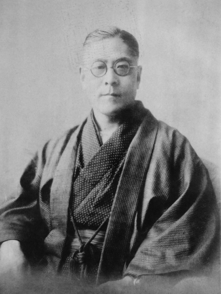 河合荣治郎，东京帝国大学的经济学教授。早在1924年他就亲赴维也纳向当时正处于事业低谷的熊彼特发出邀请，请他担任东京帝大的客座教授。（是的，《开门》中说是荒木光太郎，但其实是错误的）